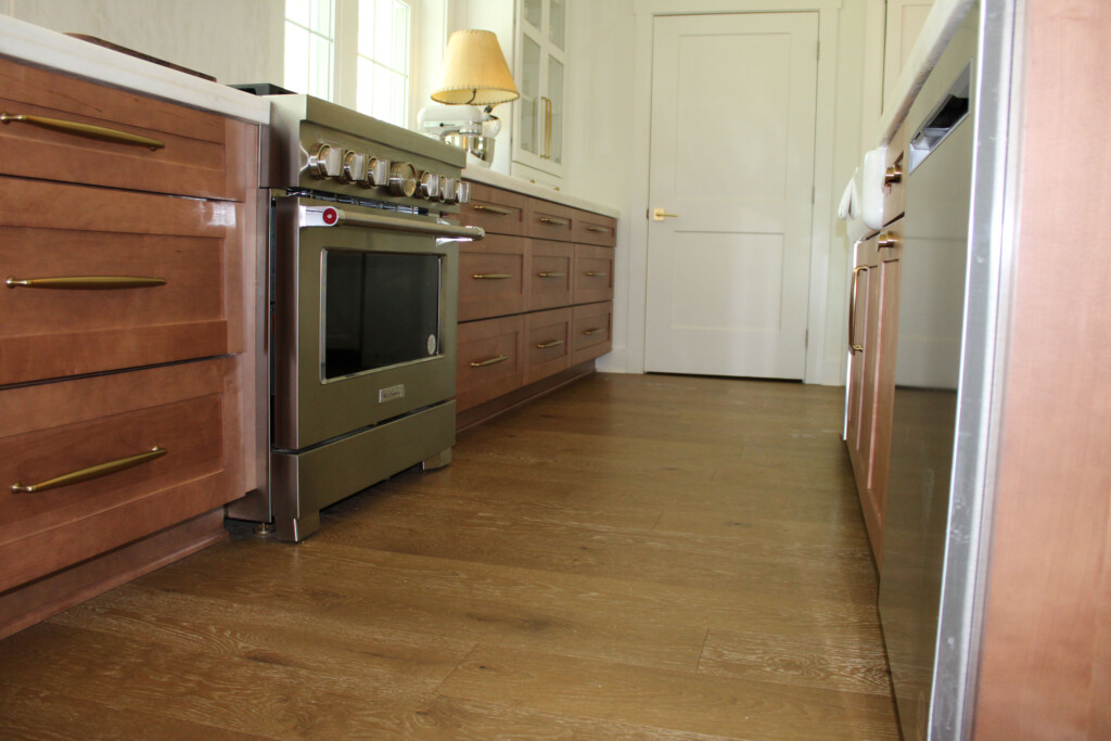 Hardwood kitchen with dark wood cabinets.