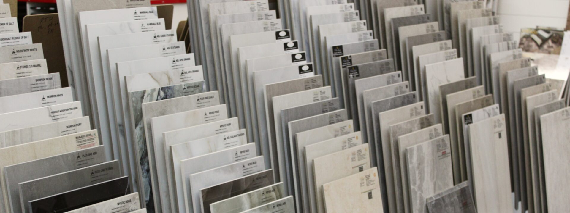 Showroom display of flooring samples in racks