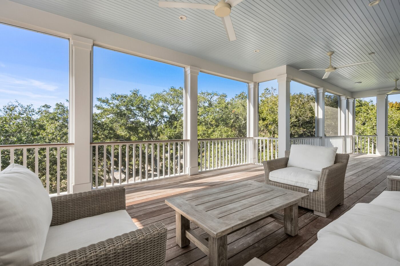 Screened porch with coastal water view