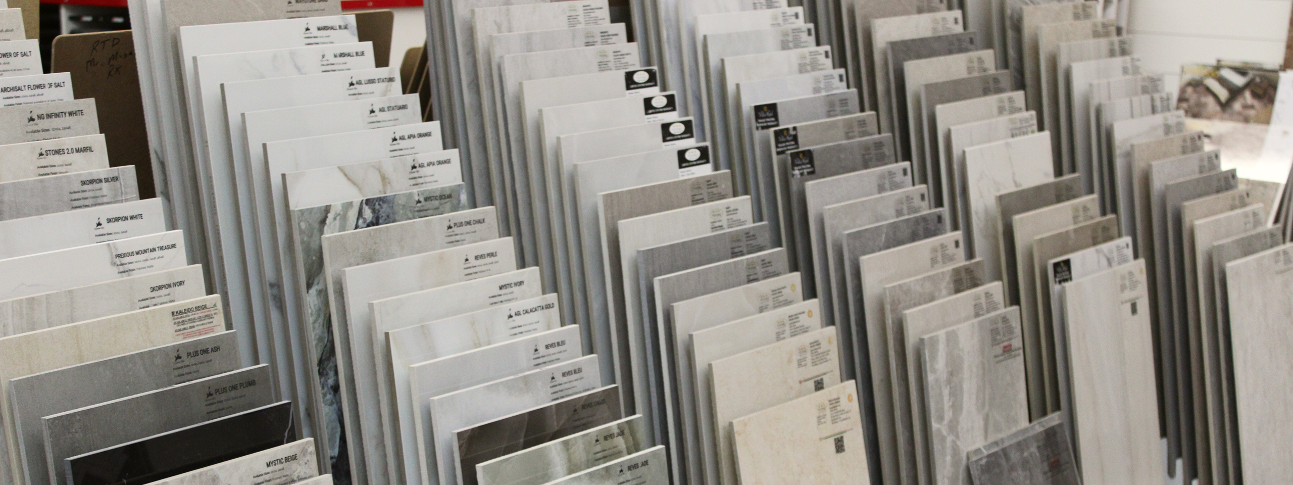 Showroom display of flooring samples in racks