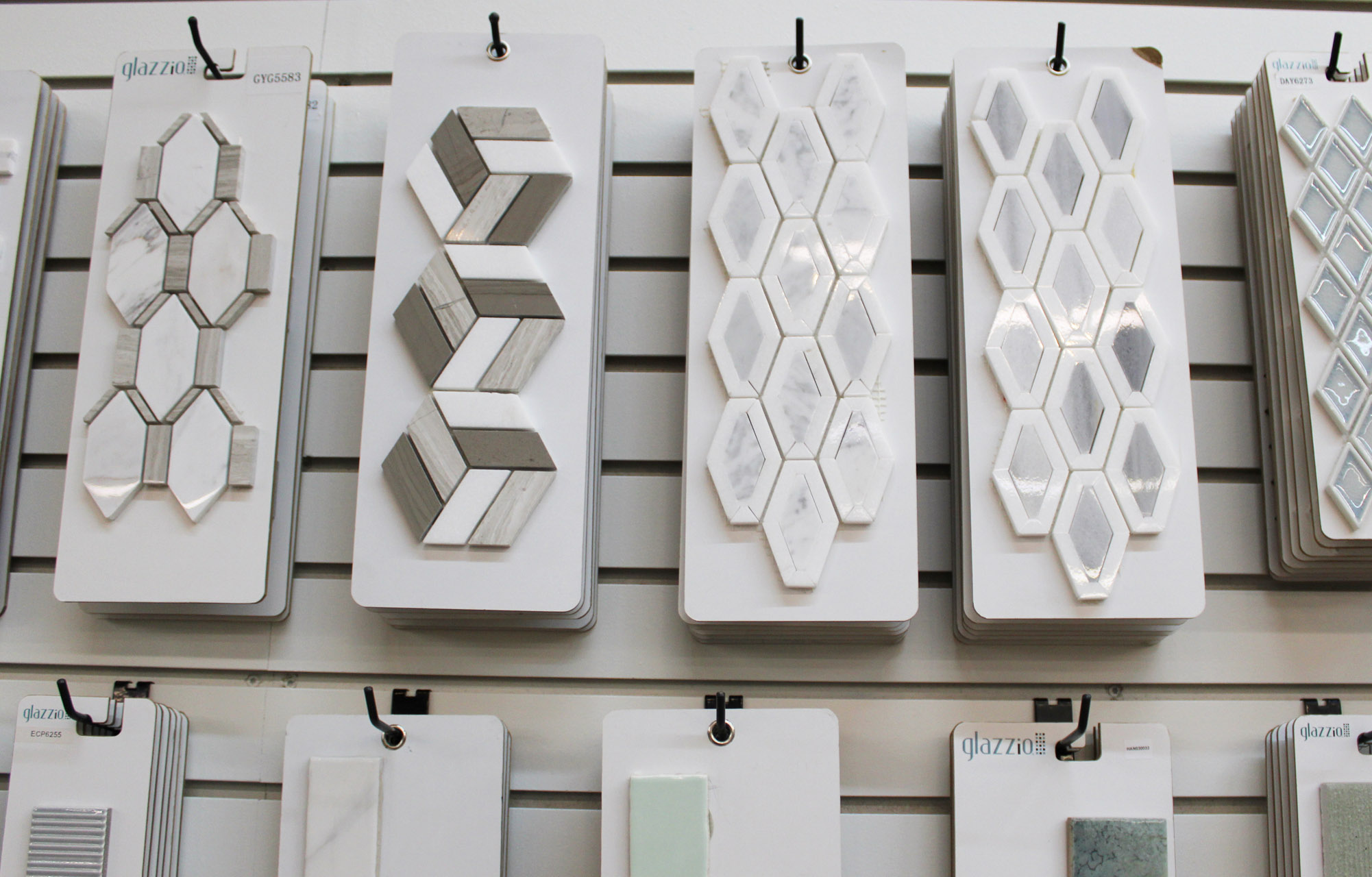 Decorative tile panels mounted on showroom wall